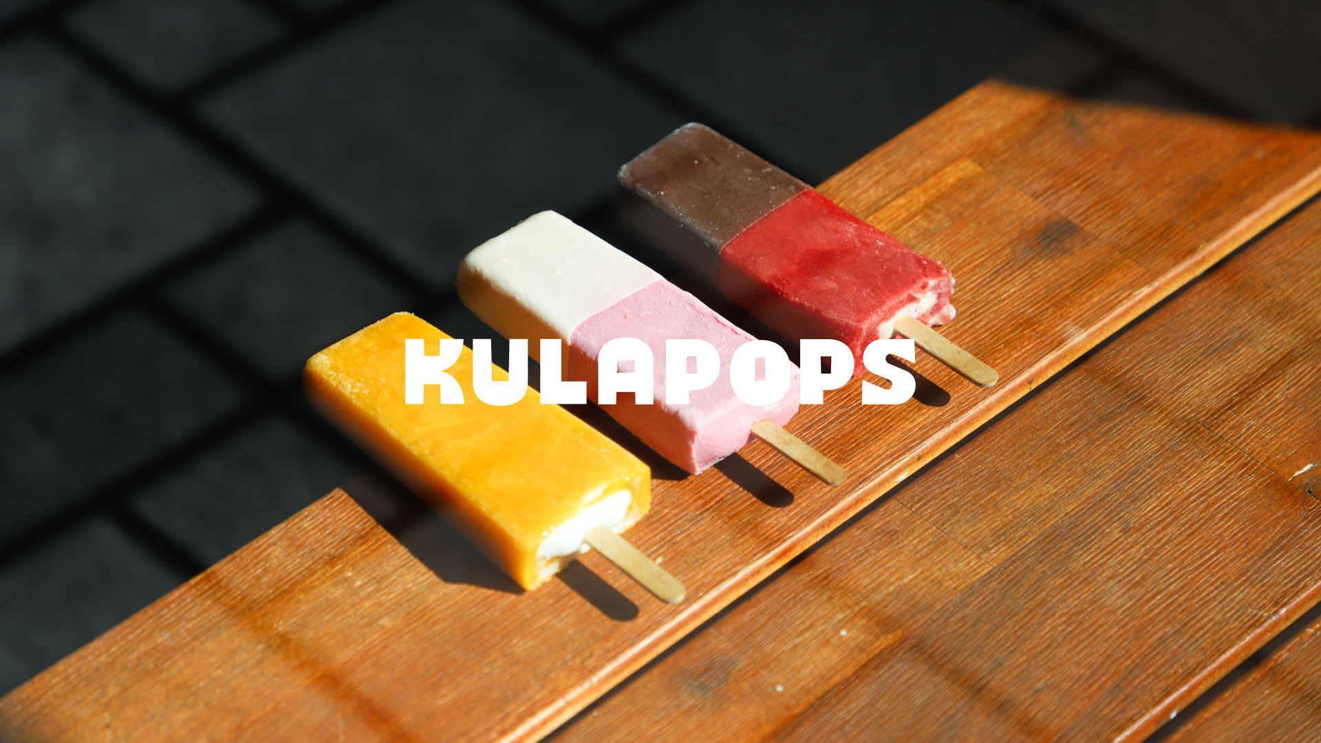 photo of popsicles with logo on top