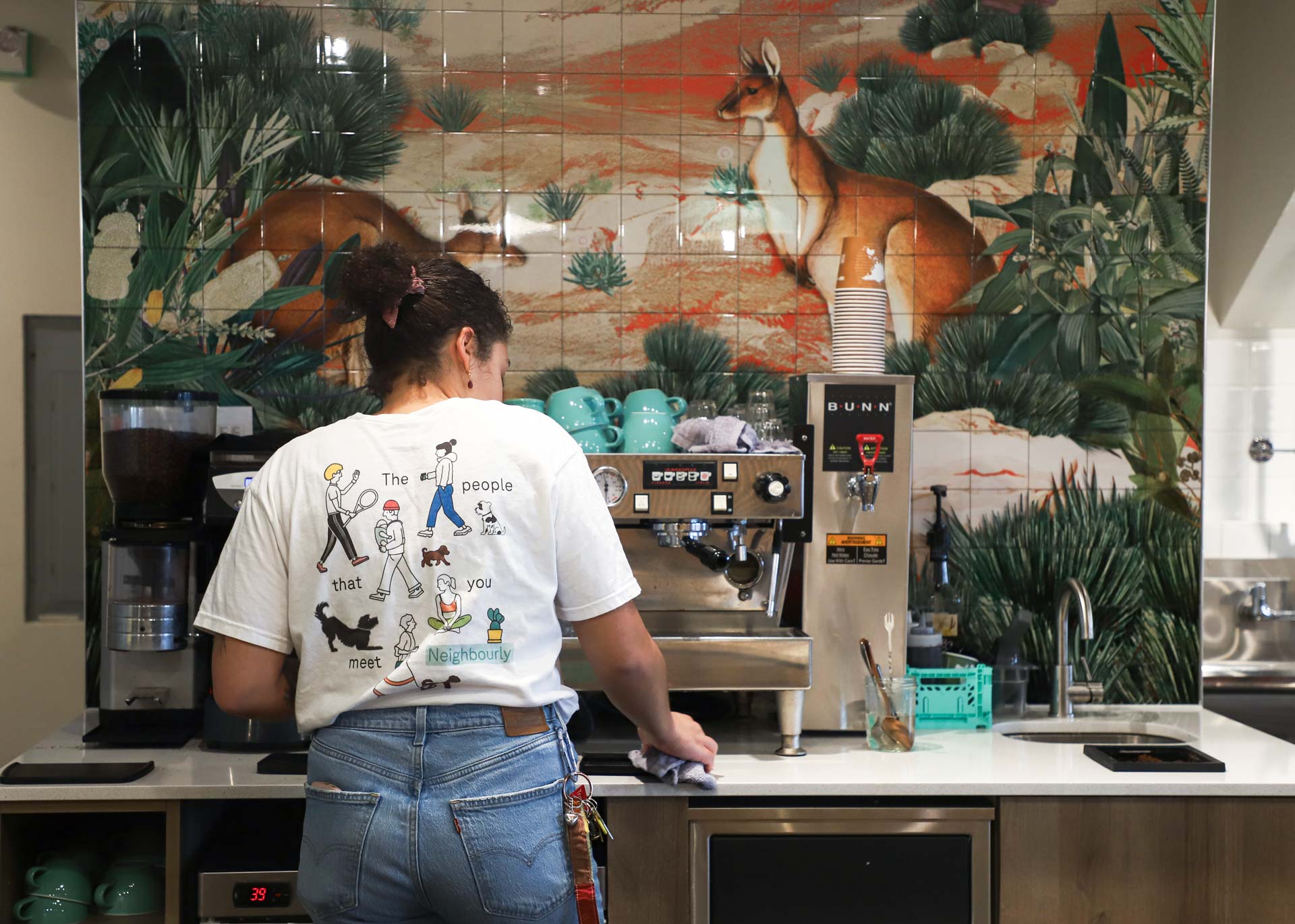 Barista wearing a shirt design with graphics