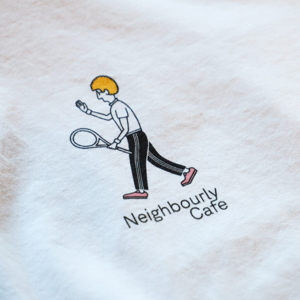 photo of logo and tennis player illustration on shirt